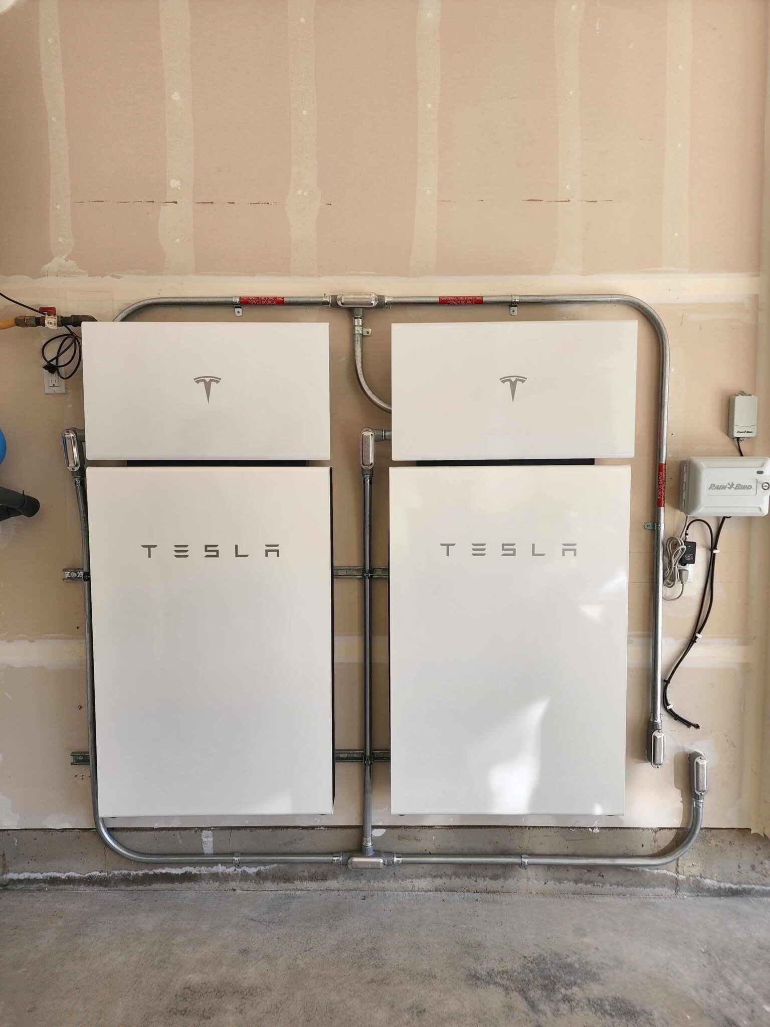 Two wall mounted Powerwall + inside garage