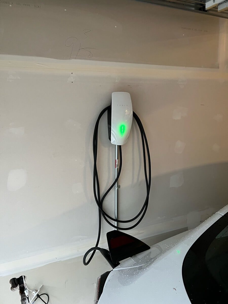Tesla Wall Connector Installed by Electrical panel using EMT and connected to Tesla EV